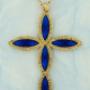 Crucifixo banhado a ouro com navetes azuis